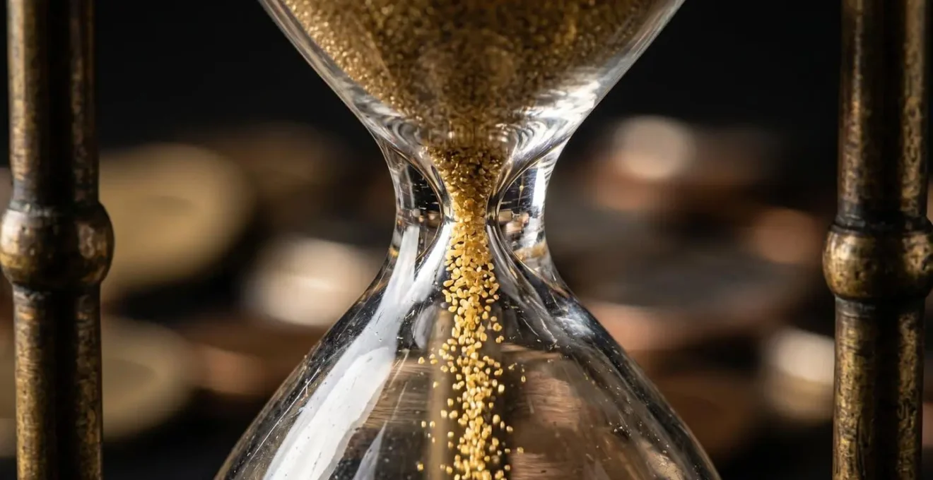 Hourglass with coins representing timing of capital asset disposals