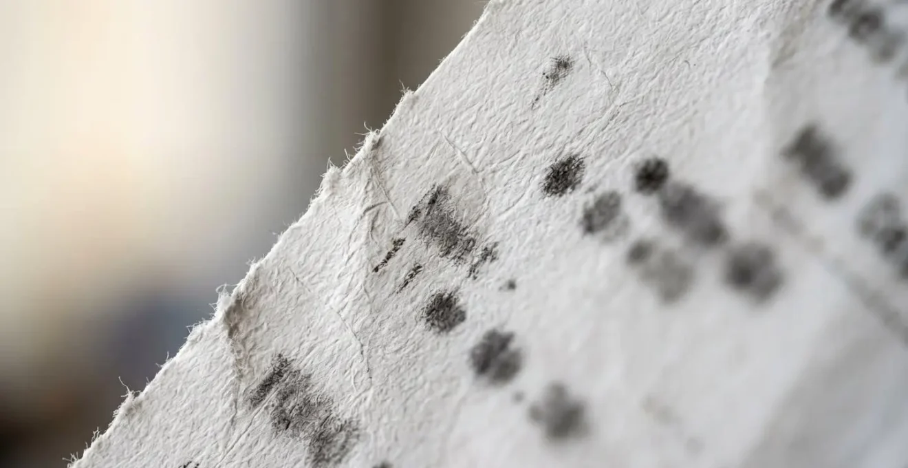 Close-up macro view of VAT receipt texture showing paper fibers and ink details
